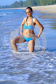 Woman with bikini blue show sexy pretty at the beach