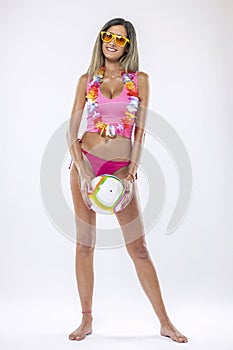 Woman in bikini holding beach ball photo