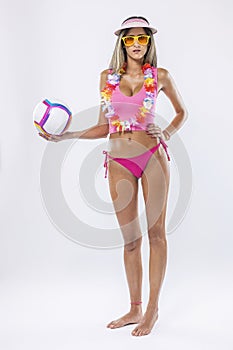 Woman in bikini holding beach ball photo