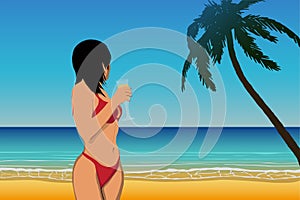 woman in bikini looking into the distance on a sandy beach near the ocean