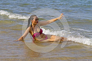 Woman and bikini pink injoy on beach