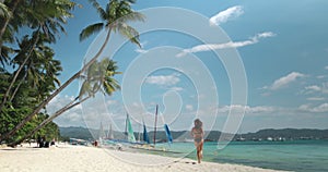 Woman in bikini run sand shore White Beach Boracay