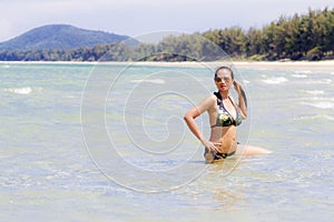 Woman and bikini show pretty with sunshine on beach