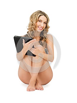 Woman in bikini with tablet pc computer