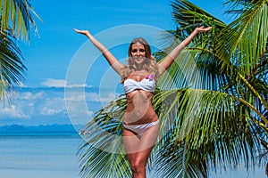 Woman in bikini at tropical beach