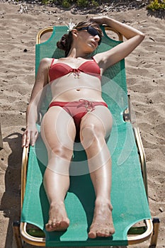 Woman in bikinis sunbathing