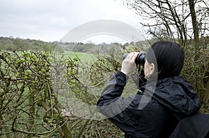 Woman birdwatching photo