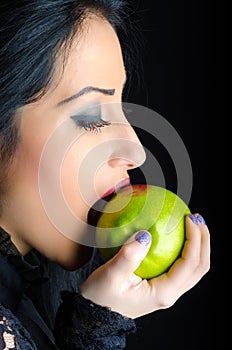 Woman Biting a Lipstick Smeared Green Apple