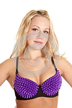 Woman black bra purple spikes