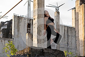 Woman in Black Casual Outfit with Exposed Pillars