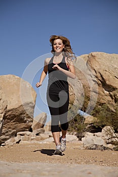 Woman black clothes running smile