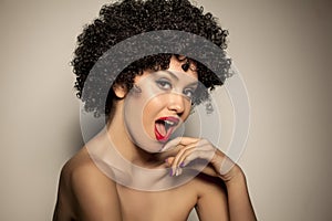 Woman with black curly wig