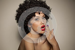 Woman with black curly wig