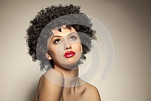 Woman with black curly wig