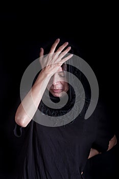 Woman on black with distress gesture