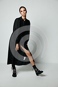 woman in black dress bare leg fashion black boots