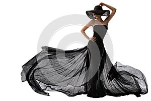 Woman Black Dress Fashion. Elegant Lady in Hat. Model Silhouette in Evening Long Black Gown Fluttering on Wind. Isolated White