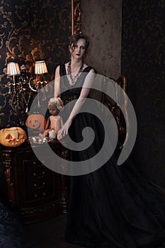 Woman in black dress for Halloween