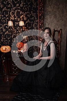 Woman in black dress for Halloween