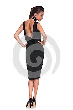 Woman in a black dress with naked back