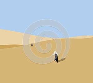 Woman in black dress walking on the dunes in the desert during early morning at sunrise.