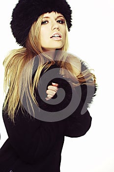 Woman in black fur hat and coat