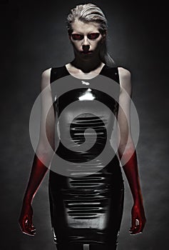 Woman in black latex dress photo