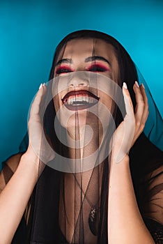 Woman with black makeup, closed eyes