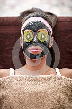 Woman with black mask on face