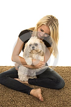 Woman black shirt with dog on lap sitting