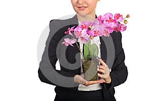 Woman in black suit holding flowerpot with photo