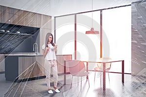 Woman in black and wooden kitchen corner