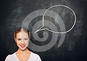 Woman at blank blackboard