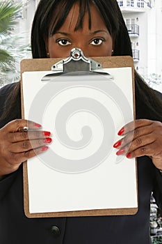 Woman with Blank Clipboard at Hotel Lobby