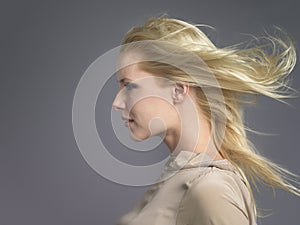 Woman With Blond Hair Blowing In Wind