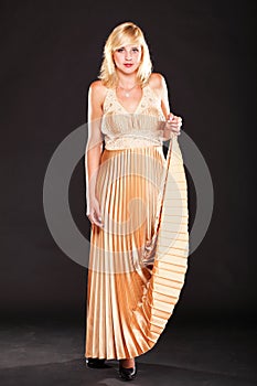 Woman blonde fashion model in yellow dress