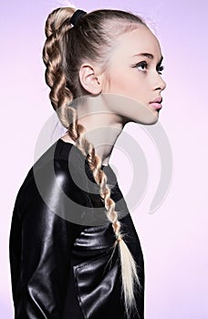 Woman with blonde hair plait in profile