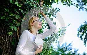 Woman blonde take break relaxing in park reading book. Bookworm student relaxing with book green nature background. Girl