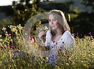 Woman in blooming meadow