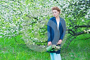 Woman in blooming spring garden