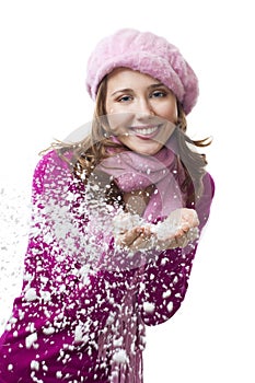 Woman blow snowflakes from hands