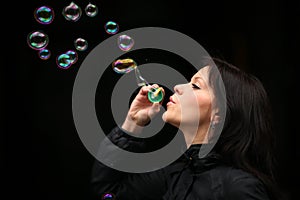 Woman blowing bubbles