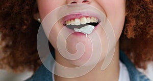 Woman blowing bubbles chewing gum candy for fun, carefree and happy mood in urban city outdoor. Closeup face mouth of