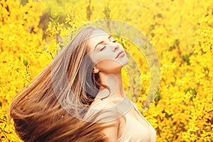 Woman with blowing hair portrait. Beautiful girl on fantasy background