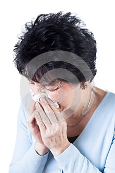 Woman blowing her nose