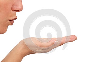 Woman blowing on her open hand