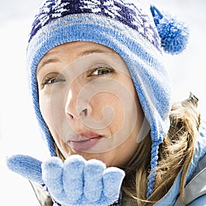 Woman blowing kiss.