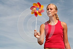 Woman Blowing Pinwheel