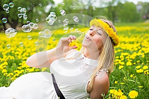 Woman blowing soap bubbles