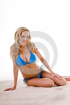 Woman In Blue Bikini On Beach